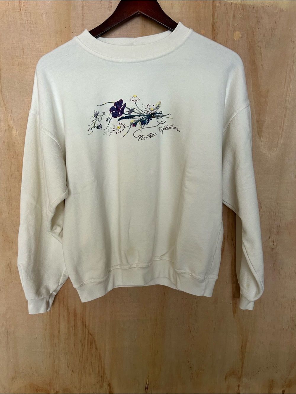 Northern Reflections Cream Crewneck Sweatshirt with Purple Floral Graphic